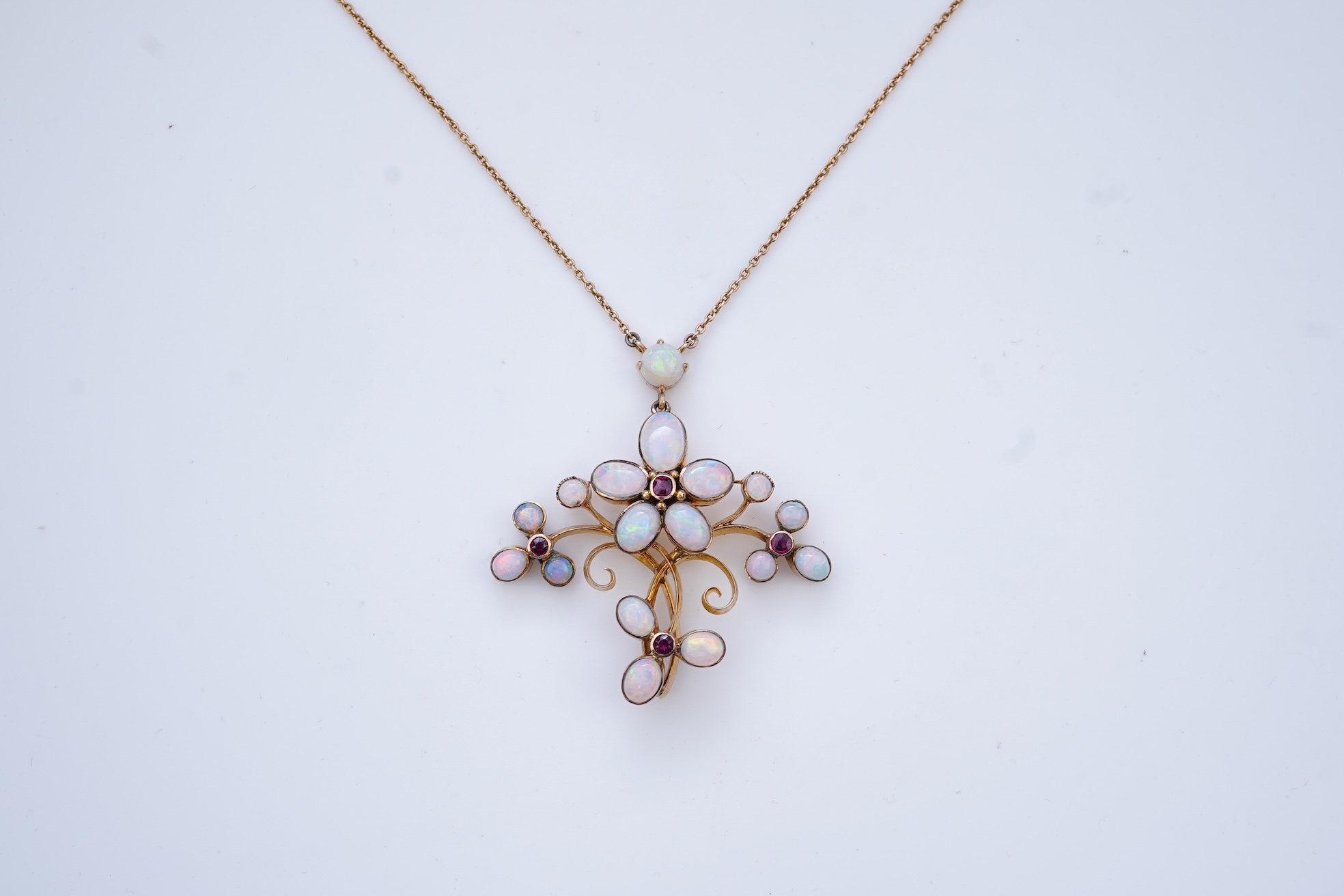 An opal and garnet pendant necklace, circa 1900